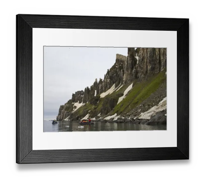 Framed Print : Tourists in Zodiac inflatable boats below high cliffs, Alkenfjellet, Spitzbergen, Svalbard, july Framed Print : Tourists in Zodiac inflatable boats below high cliffs, Alkenfjellet, Spitzbergen, Svalbard, july