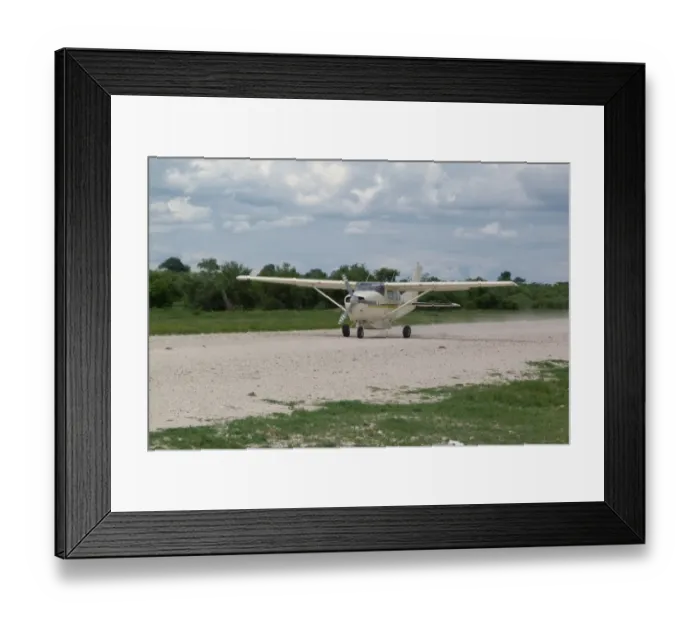 Framed Print : Light aeroplane taking off from runway, Okavango Delta, Botswana