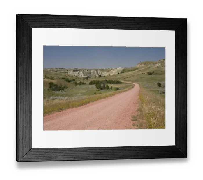 Framed Print : View of red scoria road in ranch country, Badlands, North Dakota, U. S. A. august Framed Print : View of red scoria road in ranch country, Badlands, North Dakota, U. S. A. august