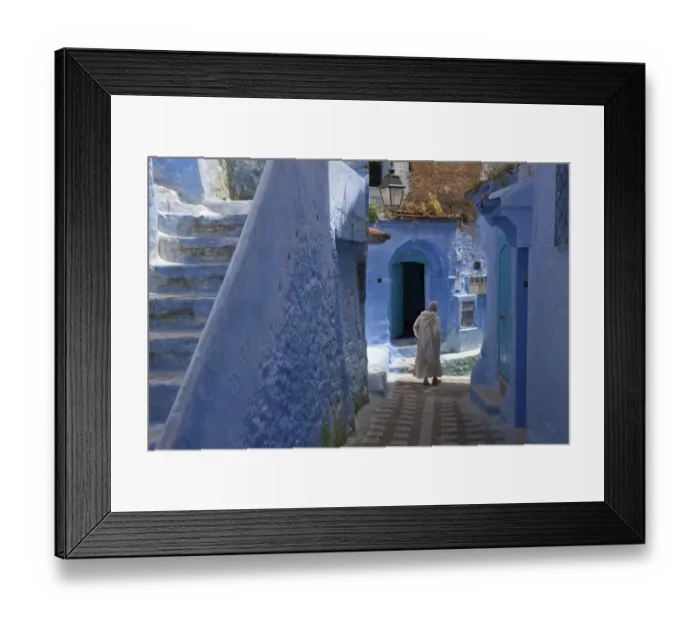 Framed Print : Man wearing djellaba walking beside blue buildings and stairway in alley of city, Chefchaouen, Morocco, april Framed Print : Man wearing djellaba walking beside blue buildings and stairway in alley of city, Chefchaouen, Morocco, april