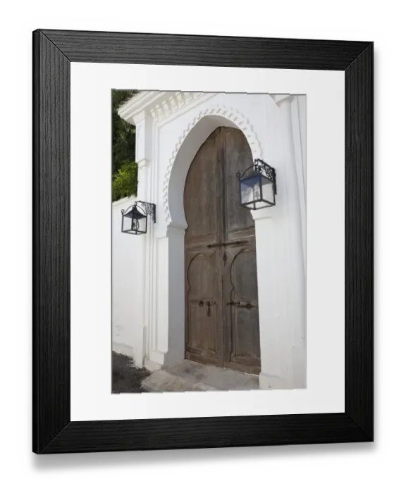 Framed Print : Wooden door and lanterns in street of coastal city, Tangier, Morocco, april Framed Print : Wooden door and lanterns in street of coastal city, Tangier, Morocco, april