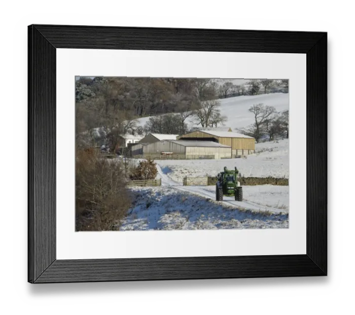 Framed Print : John Deere tractor travelling along snow covered farm track, with farm buildings in background, Whitewell, Lancashire, England, november Framed Print : John Deere tractor travelling along snow covered farm track, with farm buildings in background, Whitewell, Lancashire, England, november