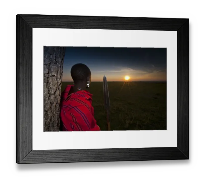 Framed Print : Masai tribesman with spear, looking over grassland at sunset, Masai Mara, Kenya