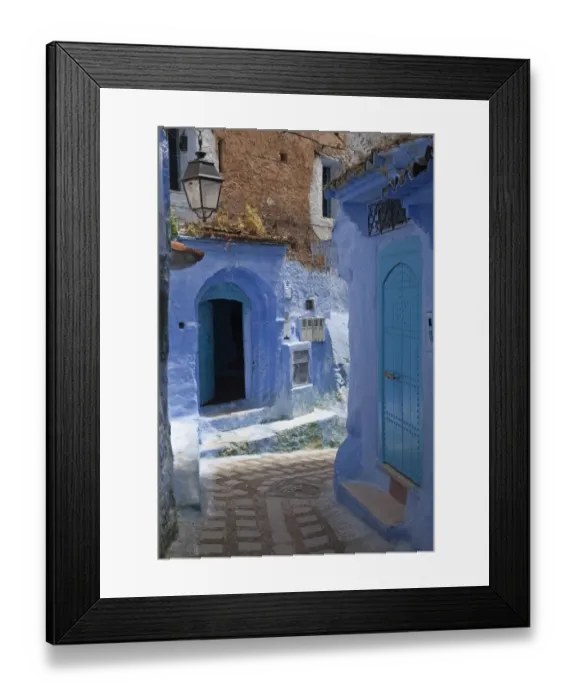 Framed Print : Blue door and buildings in alley of city, Chefchaouen, Morocco, april Framed Print : Blue door and buildings in alley of city, Chefchaouen, Morocco, april