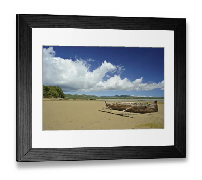 Framed Print : View of sandy beach with small boat, Nosy Be, Madagascar