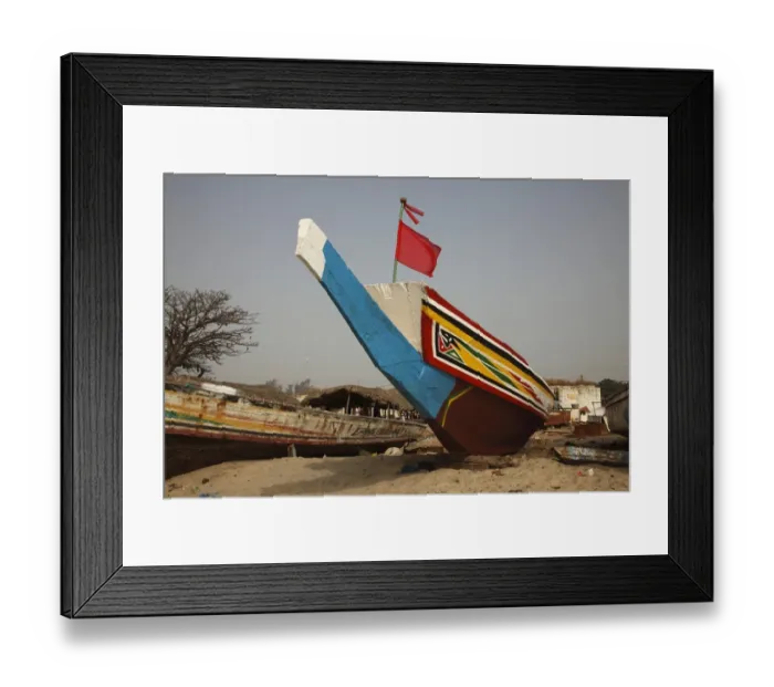 Framed Print : Traditional fishing boat on beach, Gambia, january Framed Print : Traditional fishing boat on beach, Gambia, january