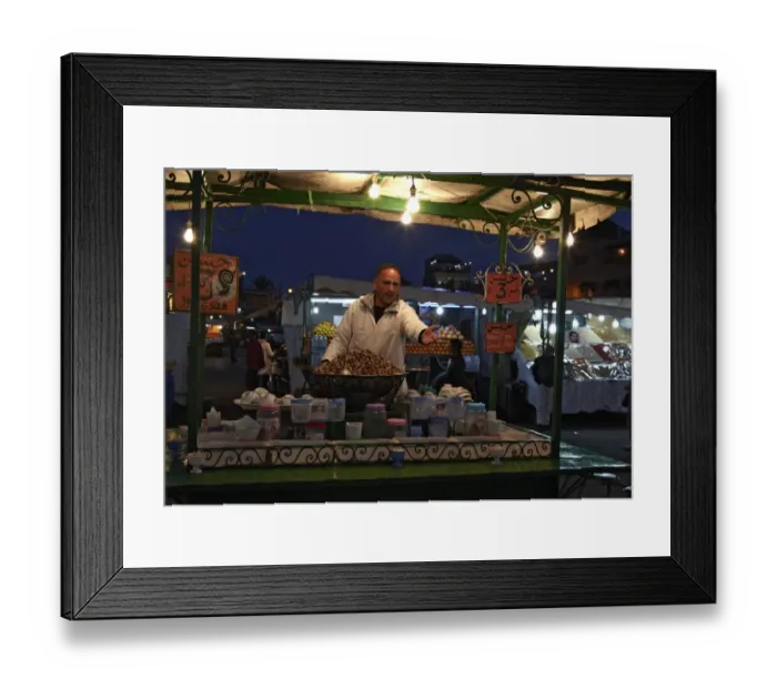 Framed Print : Street vendor selling snails at food stall, in market at night, Marrakech, Morocco, february Framed Print : Street vendor selling snails at food stall, in market at night, Marrakech, Morocco, february