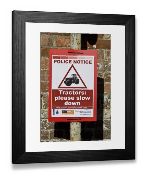 Framed Print : Police Notice - Tractors please slow down sign in village, Dorset, England, october Framed Print : Police Notice - Tractors please slow down sign in village, Dorset, England, october