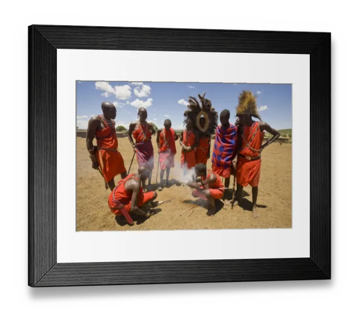 Framed Print : Masai tribesmen lighting fire at edge of village, Masai Mara, Kenya Framed Print : Masai tribesmen lighting fire at edge of village, Masai Mara, Kenya