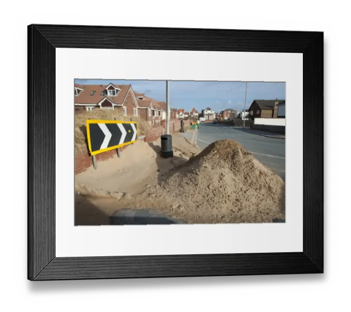 Framed Print : Council workers clearing away sand blown from beach and dunes onto road and pavement in seaside resort town, Lytham St. Anne's, Lancashire, England, january Framed Print : Council workers clearing away sand blown from beach and dunes onto road and pavement in seaside resort town, Lytham St. Anne's, Lancashire, England, january