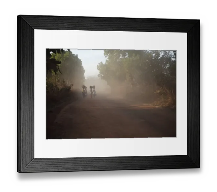 Framed Print : Women carrying goods for market on heads, walking on dusty dirt road, Gambia Framed Print : Women carrying goods for market on heads, walking on dusty dirt road, Gambia
