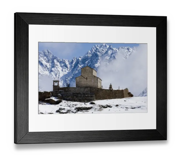 Framed Print : Monastery in village with snow covered mountains, near Kazbegi, Great Caucasus, Caucasus Mountains, Georgia, april Framed Print : Monastery in village with snow covered mountains, near Kazbegi, Great Caucasus, Caucasus Mountains, Georgia, april