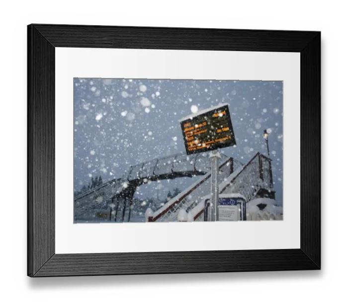 Framed Print : Train delayed sign at railway station during snowstorm, Aviemore Station, Cairngorms N. P. Grampian Mountains, Scotland, january