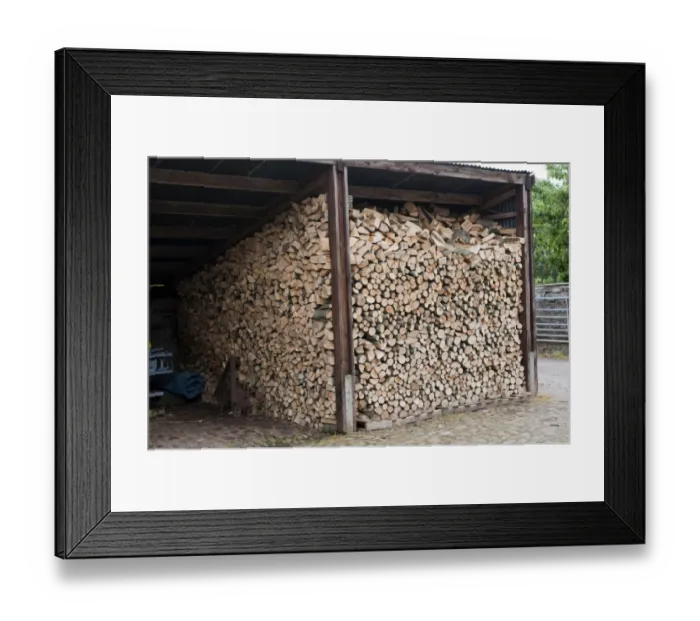Framed Print : Firewood stored in farm shed, England, june Framed Print : Firewood stored in farm shed, England, june