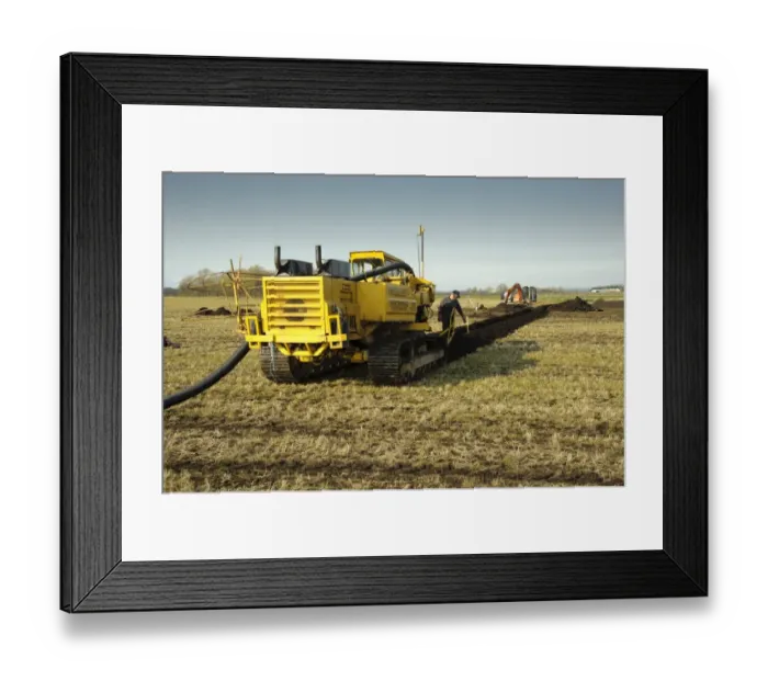 Framed Print : Field drainage, continuous pipe laying machine working in arable field, Pilling, Lancashire, England, march Framed Print : Field drainage, continuous pipe laying machine working in arable field, Pilling, Lancashire, England, march
