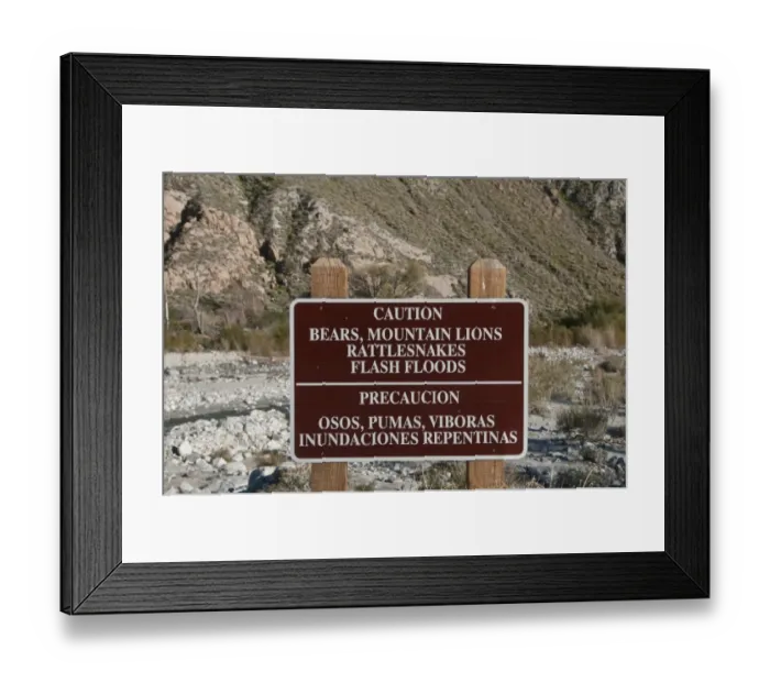 Framed Print : Caution, Bears, Mountain Lions, Rattlesnakes, Flash Floods bilingual warning sign in desert, Whitewater Preserve, Southern California, U. S. A Framed Print : Caution, Bears, Mountain Lions, Rattlesnakes, Flash Floods bilingual warning sign in desert, Whitewater Preserve, Southern California, U. S. A