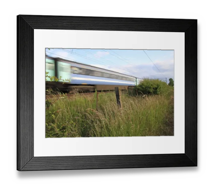 Framed Print : Tall grass growing in wasteground habitat between edge of railway track with passing train and arable field, Bacton, Suffolk, England, june Framed Print : Tall grass growing in wasteground habitat between edge of railway track with passing train and arable field, Bacton, Suffolk, England, june