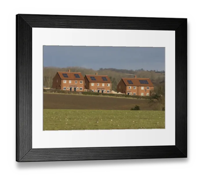 Framed Print : Houses with solar water heating panels on roof, Norfolk, England, march