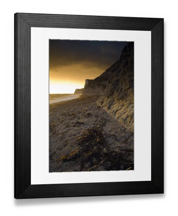 Framed Print : View of beach and limestone sea cliffs at sunset, looking west towards Weymouth, Durdle Door Beach, Dorset, England Framed Print : View of beach and limestone sea cliffs at sunset, looking west towards Weymouth, Durdle Door Beach, Dorset, England