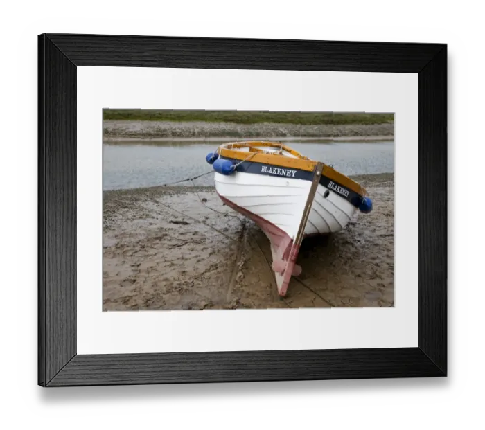 Framed Print : Boat moored on mud at edge of coastal creek, Blakeney, Norfolk, England, may Framed Print : Boat moored on mud at edge of coastal creek, Blakeney, Norfolk, England, may