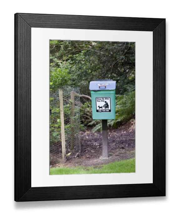 Framed Print : Domestic Dog, dog waste bin, in countryside park, England, august Framed Print : Domestic Dog, dog waste bin, in countryside park, England, august