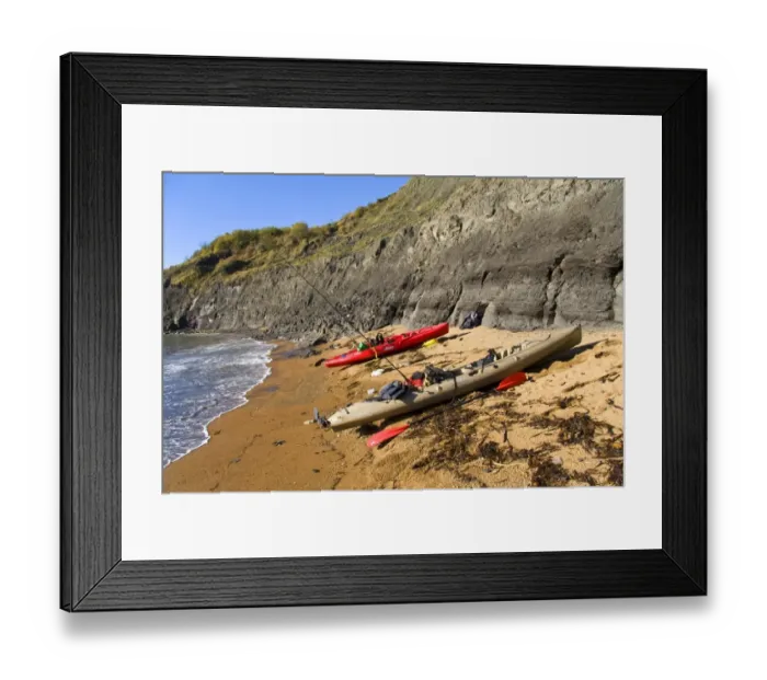 Framed Print : Kayaks with fishing rods, pulled up on beach, Chapmans Pool, Dorset, England, november
