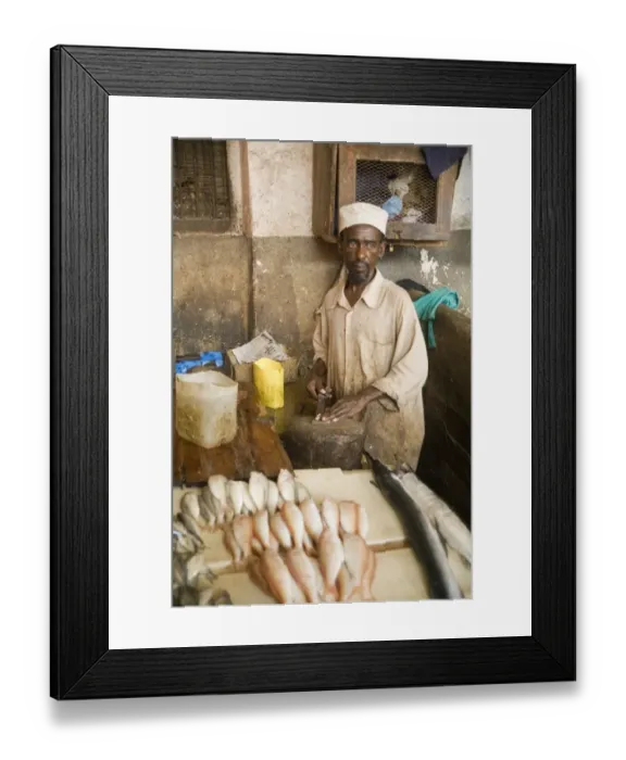 Framed Print : Fishmonger at city fish market, Stonetown, Unguja, Zanzibar, Tanzania Framed Print : Fishmonger at city fish market, Stonetown, Unguja, Zanzibar, Tanzania