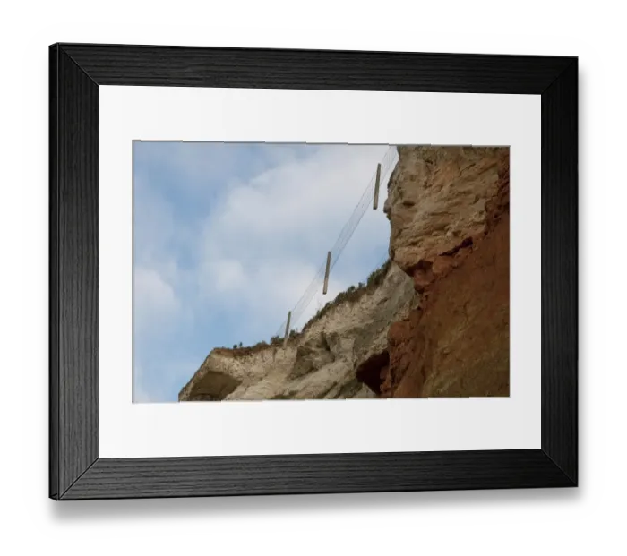 Framed Print : Suspended fencing caused by erosion of chalk and carrstone sea cliffs, Hunstanton, Norfolk, England, october Framed Print : Suspended fencing caused by erosion of chalk and carrstone sea cliffs, Hunstanton, Norfolk, England, october