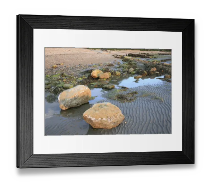 Framed Print : Rocks exposed on beach with incoming tide at dawn, Bembridge, Isle of Wight, England, june Framed Print : Rocks exposed on beach with incoming tide at dawn, Bembridge, Isle of Wight, England, june