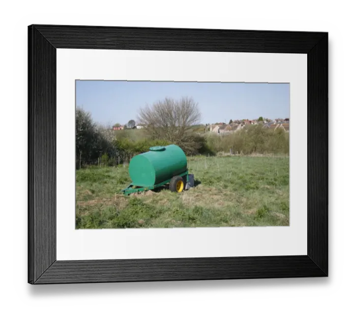 Framed Print : Cattle farming, water bowser in pasture, with village in background, Church Meadow Local Nature Reserve, Combs Ford Framed Print : Cattle farming, water bowser in pasture, with village in background, Church Meadow Local Nature Reserve, Combs Ford