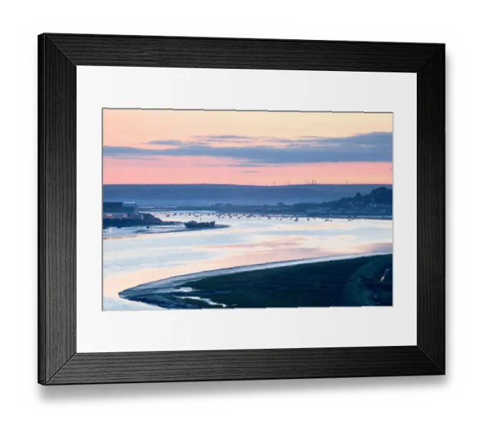 Framed Print : View of river estuary with shipyard, village and distant windfarm on banks at sunrise, Fullabrook Windfarm
