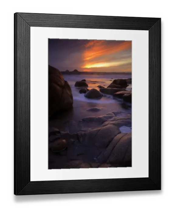 Framed Print : View of eroded rock formations on beach at sunset, near Lands End, Cornwall, England