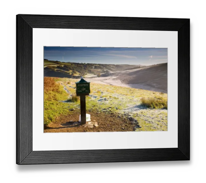 Framed Print : Old postbox by roadside, with melting frost in morning sunshine, looking towards River Barl, Landacre, Exmoor N. P