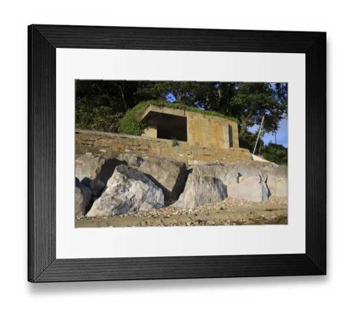 Framed Print : World War Two gun emplacement and riprap boulders at edge of beach, Bembridge, Isle of Wight, England, june Framed Print : World War Two gun emplacement and riprap boulders at edge of beach, Bembridge, Isle of Wight, England, june