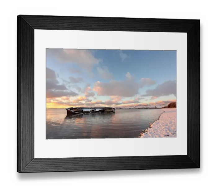 Framed Print : Snow covered riverbank and wreck of old barge partly submerged by incoming tidal river at sunset, River Taw Framed Print : Snow covered riverbank and wreck of old barge partly submerged by incoming tidal river at sunset, River Taw