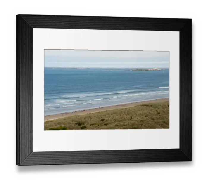 Framed Print : View of coastline with sand dunes and beach, looking towards distant Farne Islands, Bamburgh, Northumberland, England Framed Print : View of coastline with sand dunes and beach, looking towards distant Farne Islands, Bamburgh, Northumberland, England