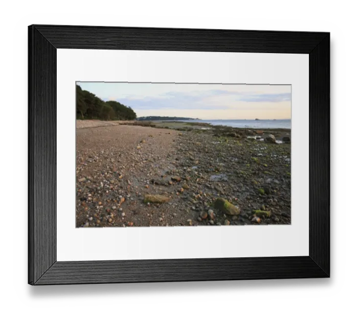 Framed Print : Pebbles and rocks exposed on beach with incoming tide at dawn, Bembridge, Isle of Wight, England, june Framed Print : Pebbles and rocks exposed on beach with incoming tide at dawn, Bembridge, Isle of Wight, England, june