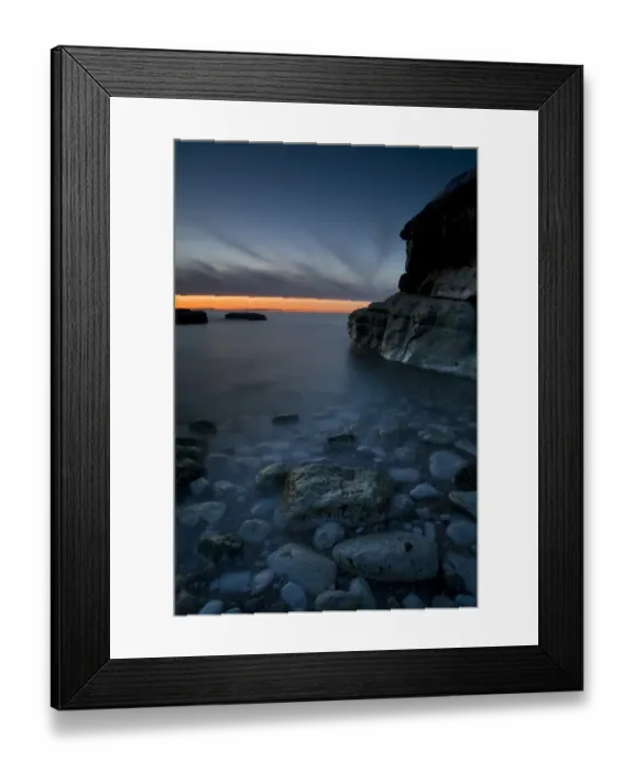 Framed Print : Bay with pebbles on beach, on chalk headland at sunset, Thornwick Bay, Flamborough Head, North Yorkshire, England, may