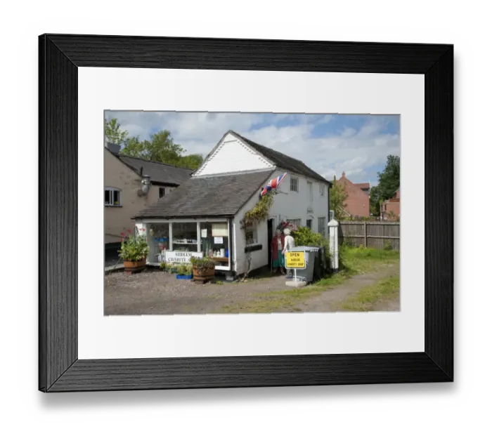 Framed Print : Village charity shop, Audlem, Cheshire, England, august Framed Print : Village charity shop, Audlem, Cheshire, England, august