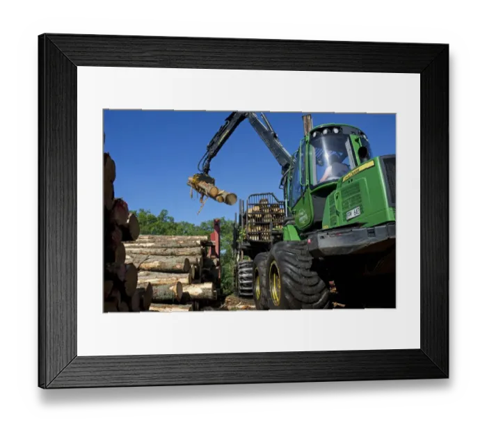 Framed Print : John Deere 1010E Forwarder loading logs onto timber barge, Archipelago Sea, Baltic Sea, Sweden, june Framed Print : John Deere 1010E Forwarder loading logs onto timber barge, Archipelago Sea, Baltic Sea, Sweden, june