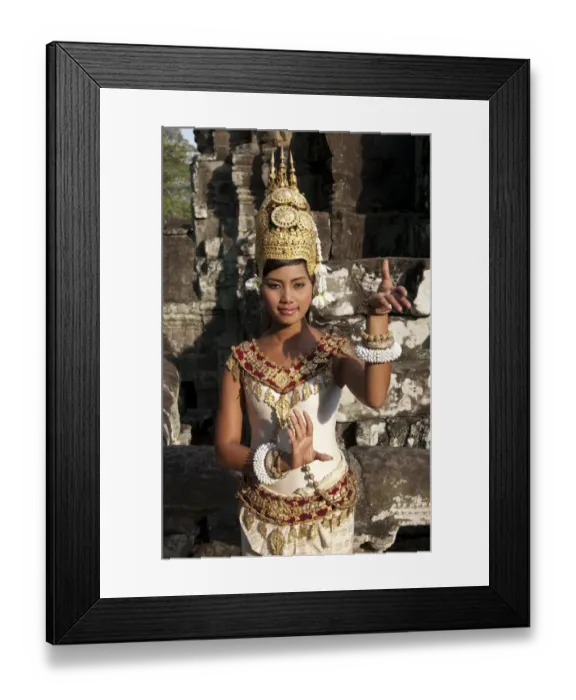 Framed Print : Girl dancer wearing Apsara (dancer) costume in Khmer temple, Bayon, Angkor Thom, Siem Riep, Cambodia Framed Print : Girl dancer wearing Apsara (dancer) costume in Khmer temple, Bayon, Angkor Thom, Siem Riep, Cambodia