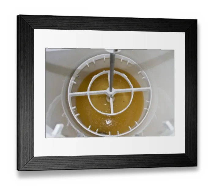 Framed Print : Looking into the spinning drum after the honey comb frames have been removing, showing the newly spun runny honey Framed Print : Looking into the spinning drum after the honey comb frames have been removing, showing the newly spun runny honey