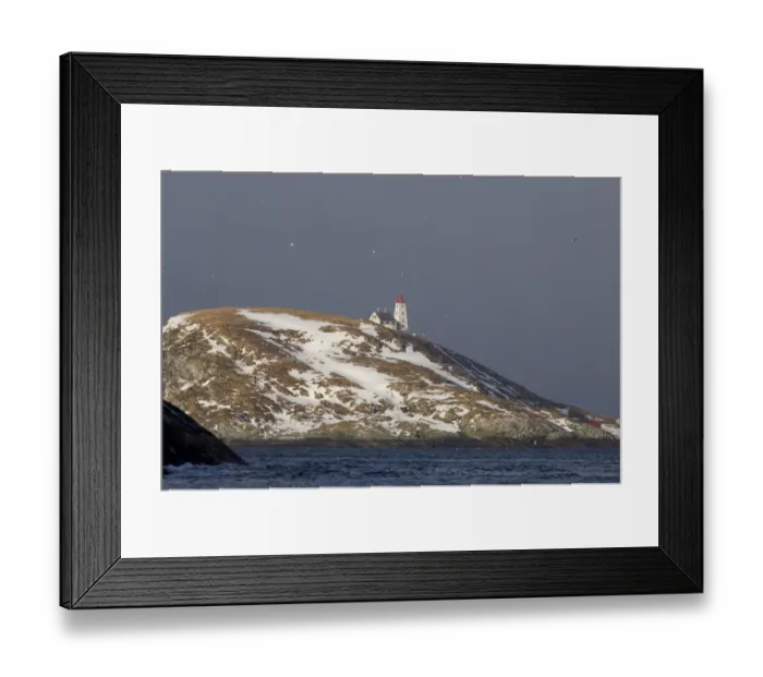 Framed Print : View of snow covered island with lighthouse, Hornoya Island, Varanger Fjord, Northern Norway, march