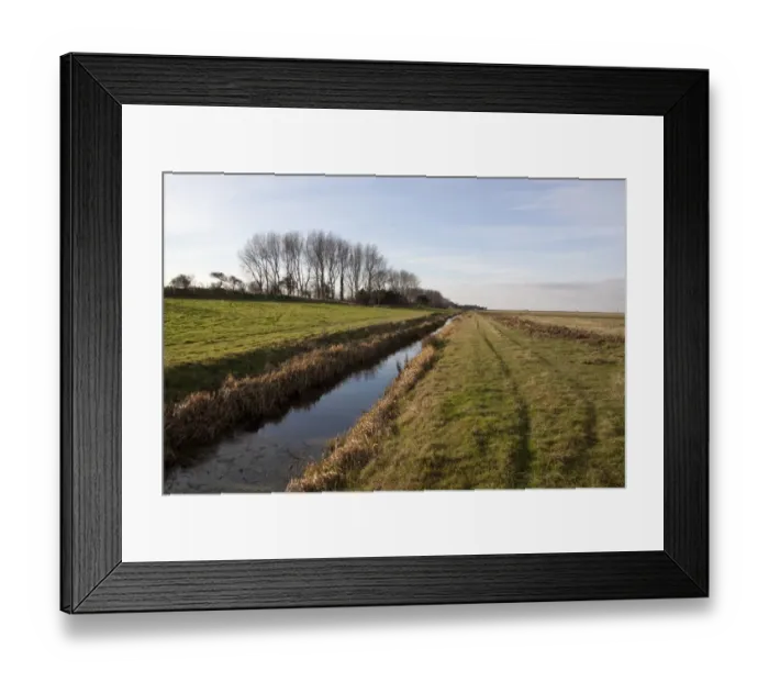 Framed Print : Dyke at Deepdale Marsh at Burnham Norton, Brancaster North Norfolk - Marsh land habitat used by winter wildfowl flocks