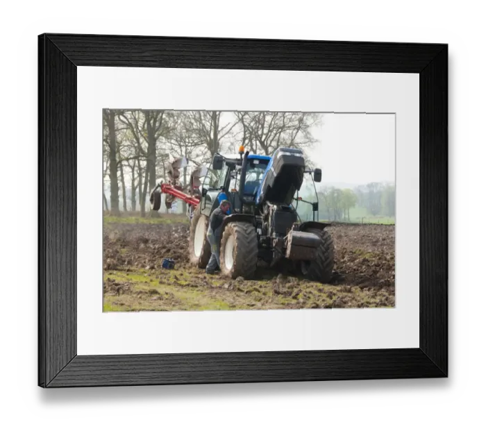 Framed Print : Farmer repairing New Holland tractor with plough in field, Lochmaben, Lockerbie, Dumfries and Galloway, Scotland, april Framed Print : Farmer repairing New Holland tractor with plough in field, Lochmaben, Lockerbie, Dumfries and Galloway, Scotland, april