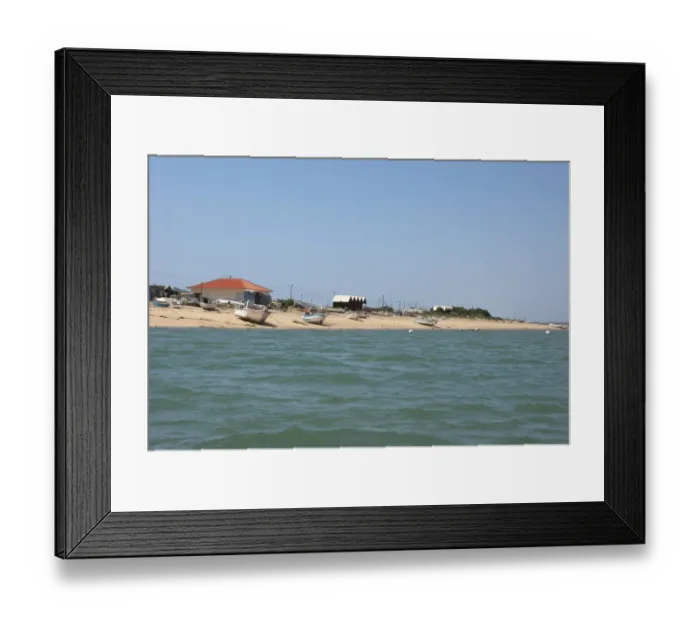 Framed Print : View of fishing village with fishermens houses on landward side of coastal spit, Ria Formosa N. P Framed Print : View of fishing village with fishermens houses on landward side of coastal spit, Ria Formosa N. P