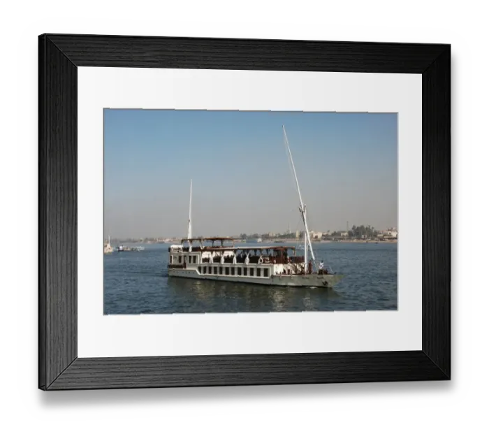 Framed Print : Dahabiya passenger boat cruising on river, River Nile, Luxor, Egypt, january Framed Print : Dahabiya passenger boat cruising on river, River Nile, Luxor, Egypt, january