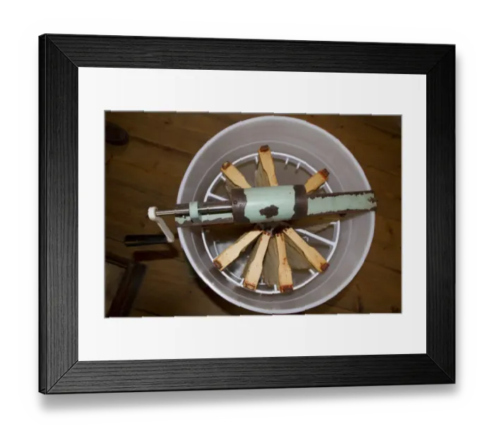 Framed Print : The honey comb frames are placed into a spinning drum and then spun at high speed to separate the honey from the comb