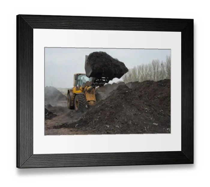Framed Print : Volvo loader turning green compost waste for aeration at municipal waste site, near Chester, Cheshire, England, march Framed Print : Volvo loader turning green compost waste for aeration at municipal waste site, near Chester, Cheshire, England, march