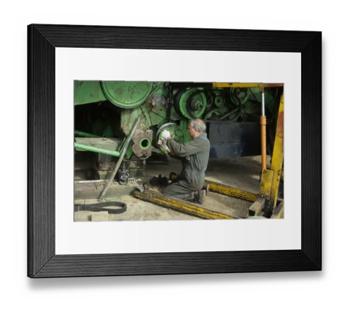 Framed Print : Farmer repairing combine harvester clutch at harvest time, West Sussex, England, august Framed Print : Farmer repairing combine harvester clutch at harvest time, West Sussex, England, august